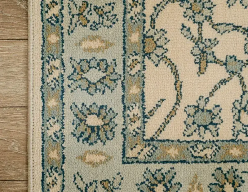 Vintage Cottage Rug Close-Up: Floral Pattern & Weave on Light Wood Floor